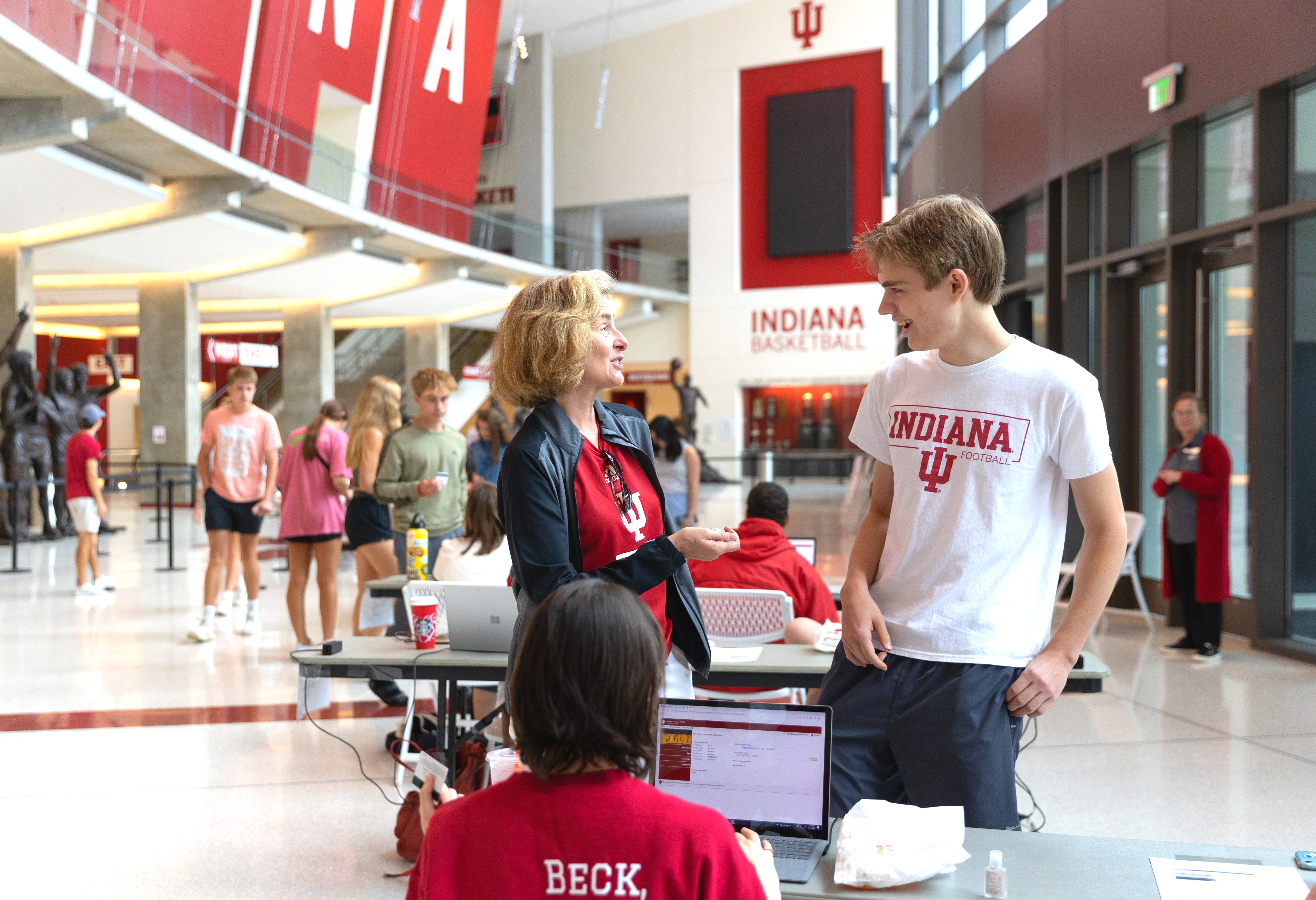 President Whitten and a first-year student share a laugh in Assembly Hall while he activates his new Crimson Card.