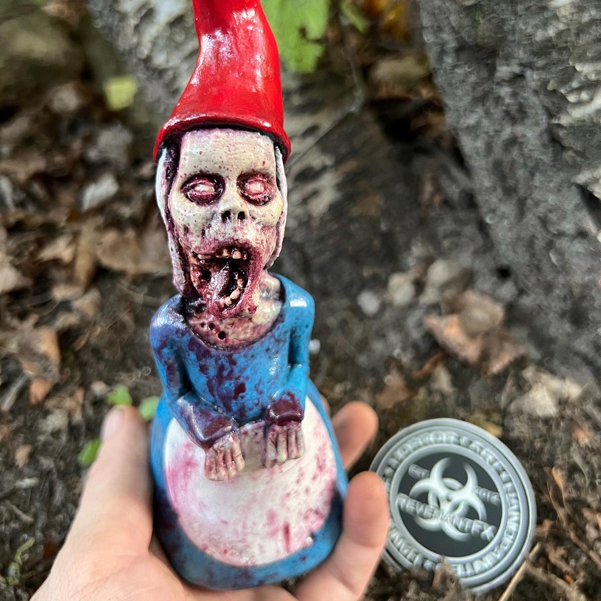 The Joy Of Gnoming: Gnorma Lee Shouldbedead The Bite Size #ZombieGnome Is A Frightfully Jaw-Dropping Gnome For Your Home!😜🧟‍♂️💀🎨👻
.
.
.
#RevenantFX #Zombiegnomes #Zombiegardengnome #Zombie #Zombies #Gnome #Gnomelife #Gnomelove #Gnomegarden #Handmade #Handpainted #Sculpture #Art