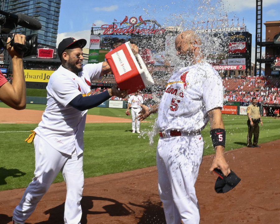 Yadier Molina throws a cooler of water at Albert Pujols' face