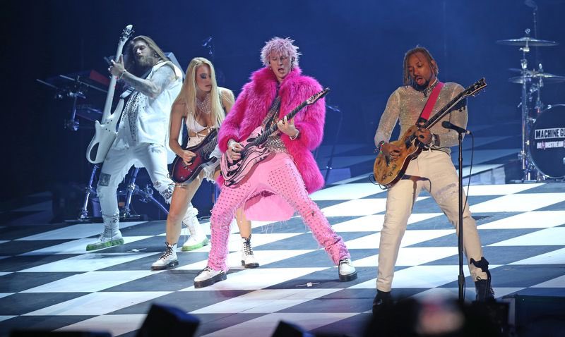 AmandaLimardi's tweet photo. We had the Ay! Music video on in the background before leaving to head to the stadium yesterday and I swear to you I caught a glimpse of him in the pink fur and knew he was going to wear it that night #mgkday #stylepsychic https://t.co/O2vgCJxM9u