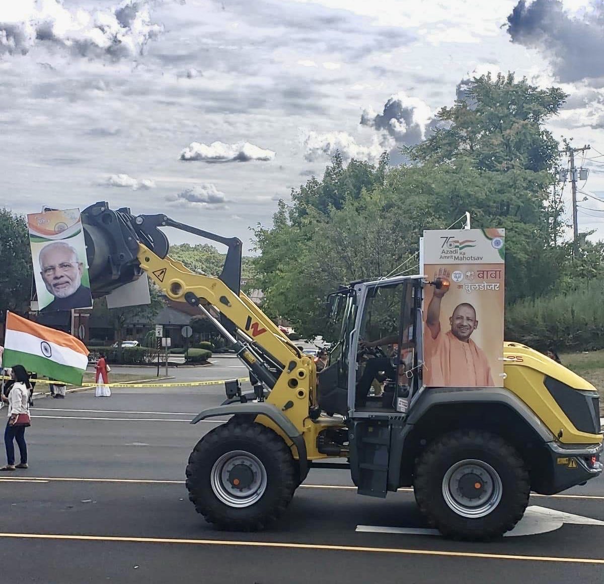 IAMCouncil's tweet photo. Today, the Hindu right-wing in Edison, New Jersey marched with bulldozers, which have become a weapon in the hands of the BJP government to destroy Muslim homes and livelihoods. https://t.co/3M3GKj8kcq