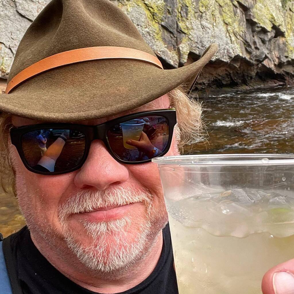 jgamet's tweet photo. Standing in the creek drinking a gin shrub. As one does. #music #folksfest #lyons #spirithound https://t.co/QzlxK9BwUr