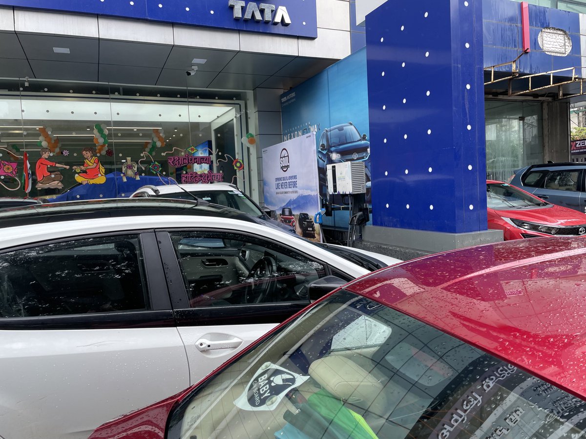 VGhodke's tweet photo. ⁦@Tatamotorsev⁩ Dear Tata Team, Please explain how to charge your car when all the dealers cars are parked around it? This is happening at many Tata Motor dealers showroom. Sorry to say but this is useless. https://t.co/VRfLxEt7Fg