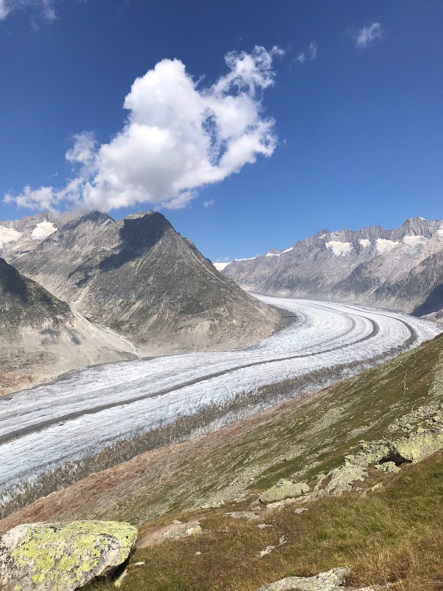 Standing close to the Great Aletsch Glacier, melting due to elevated temperatures: shrinking 50 meters per year, and 3 km shorter and 200 meter thinner since 1860. Facts: bit.ly/3JY1t5K #sustainablity is the answer ☀️ #GlobalWarming #solarenergy #RenewableEnergy #hiking