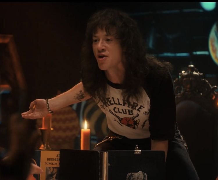 is he… is he kneeling on top of table?  WHAT