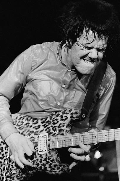 Guitarist and singer Gary Moore (1952 - 2011) performing live with a leopard print guitar, circa 1980. Photo by Denis O'Regan/Getty Images