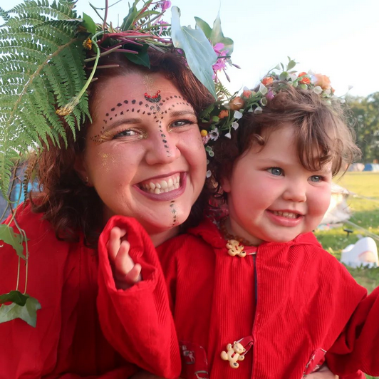 NerdyNaturopath's tweet photo. Hi folks! I am back on Twitter after a bit of a summer break! Here is a photo of me and Luna all dressed up for a fire dance at a festival we went to last month! How has everyone's summer been? 🌞#SummerBreak https://t.co/zljYLjvGzm