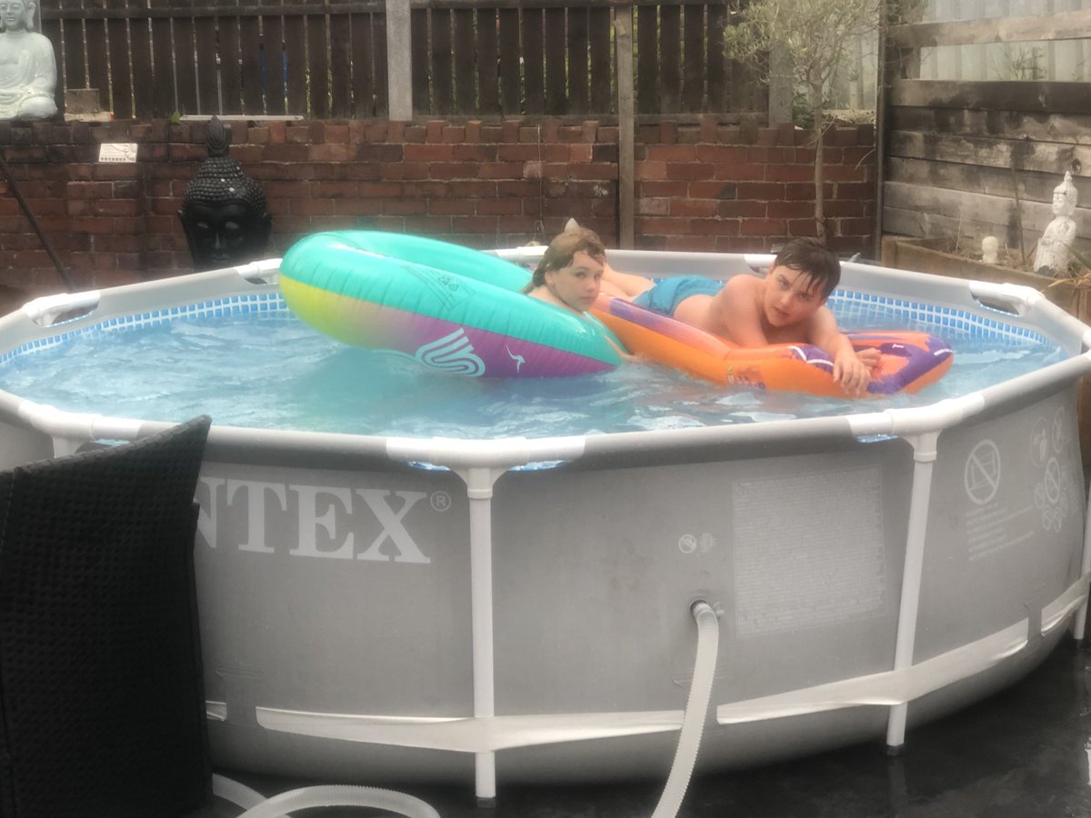 TraceyJAustin's tweet photo. Kids don’t seem to mind the rain and are getting as much time in the pool as possible before the hosepipe ban #funatgrandmas #Grandma #Sleepover https://t.co/rXk5SbMN7y