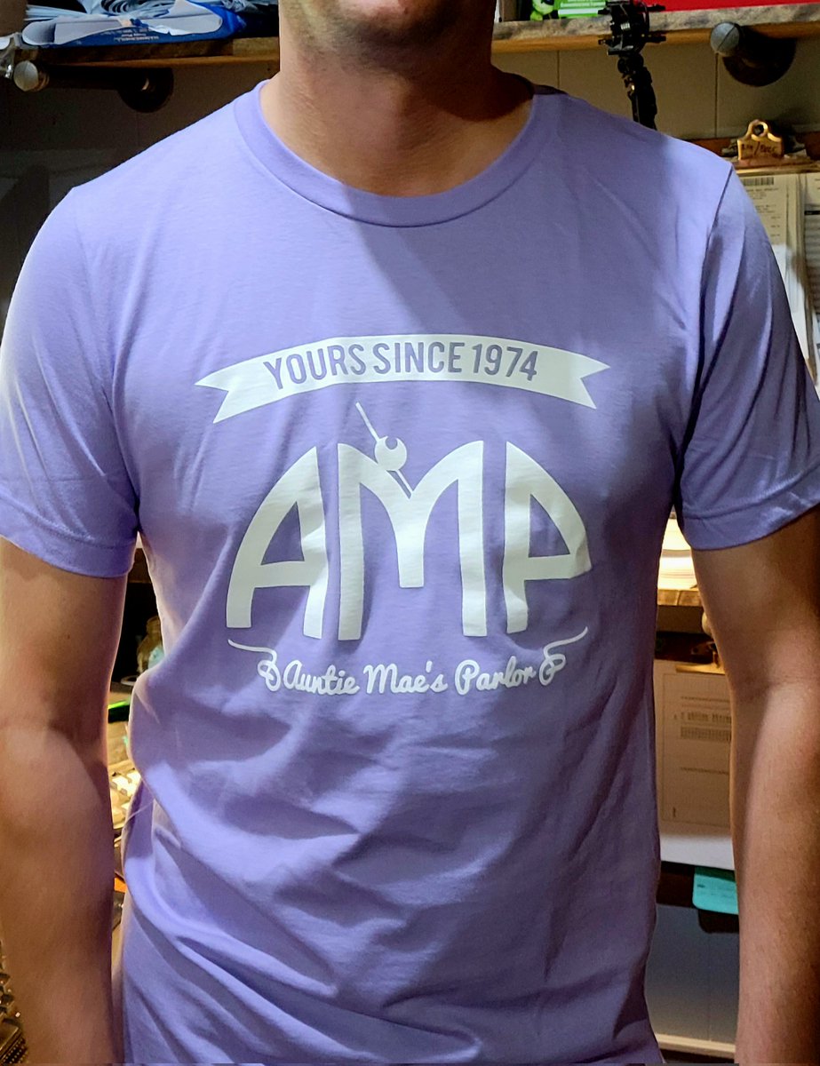 AuntieMaes's tweet photo. New shirts available! Lavender or Forest Green. Get yours at the bar or online at https://t.co/et1tYbrWqp https://t.co/7G7xaMQHkB