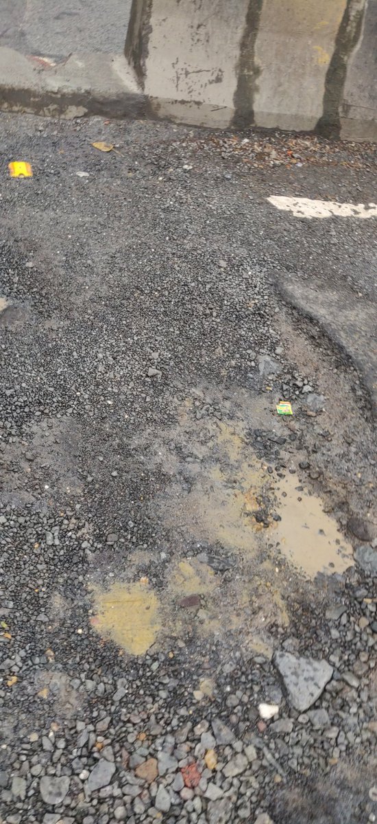 Big potholes in front of KFC on linking road Bandra . <a href="/mybmcWardHW/">Ward HW BMC</a>