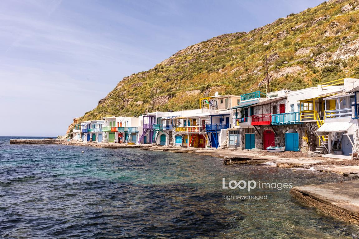 The traditional fishing village architecture by the sea at Klima in Milos #greece #milos #fishing #colour #colourful #klima #multicoloured #cliff #hill #island #village #dwellings #MediterraneanSea #life #traditional @AlexHarePhoto