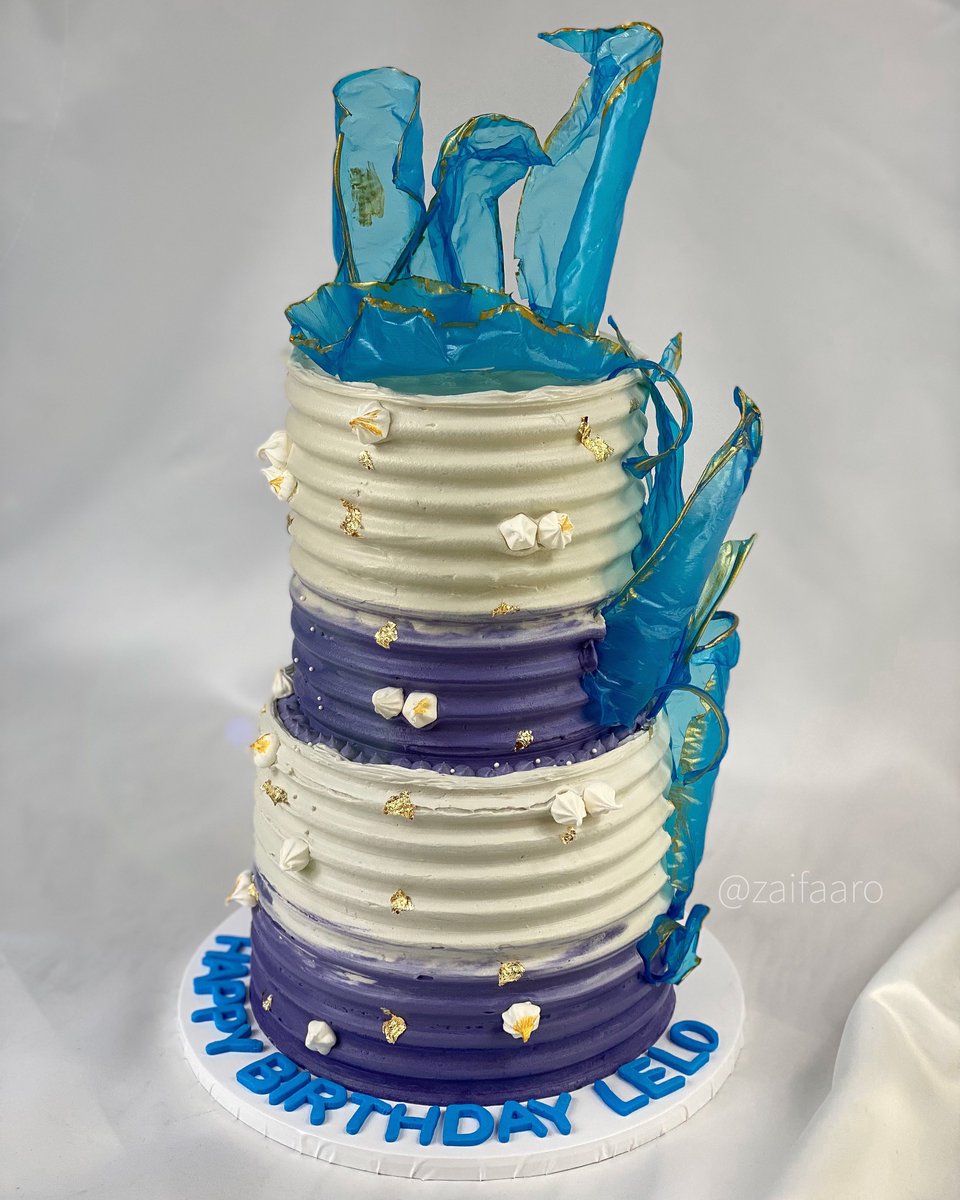 zaifaaro's tweet photo. A 2 tier purple, white &amp; blue themed cake with rice paper sail and decorations! https://t.co/d45wxqCXPH