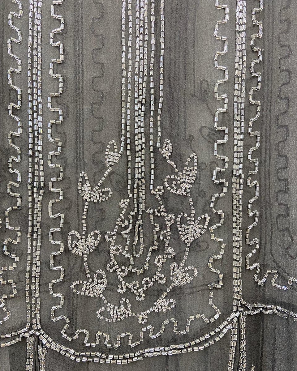 Landi_company's tweet photo. Detail from a #1920s #beaded #flapperdress, still intact with its original label! #1920sfashion #conservation #textileconservation #costume #costumeconservation https://t.co/Ig4ERr5Jqj