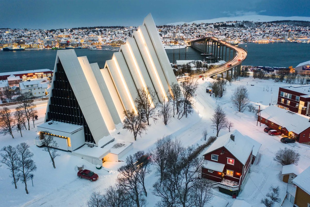 cntraveller's tweet photo. Tromsø, Norway ✨ The strikingly modern Arctic Cathedral towers over this Norwegian city, where the Northern Lights are known to light up the skies. https://t.co/69YiX242k5