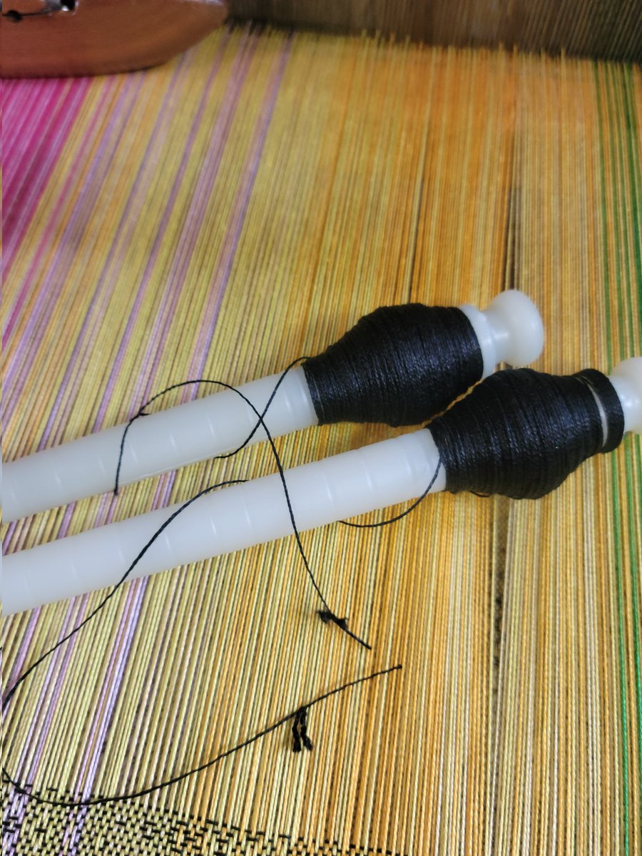 'Knot' happy with the knots in this tube of weft. My first two attempts to wind a pirn from a new tube of black cotton got me this far before I encountered a knot...Twice! #knottyknotty #windingweftpirns #slowingmedown #handwoveninnovascotia #handwovenbabywrap #OOAK