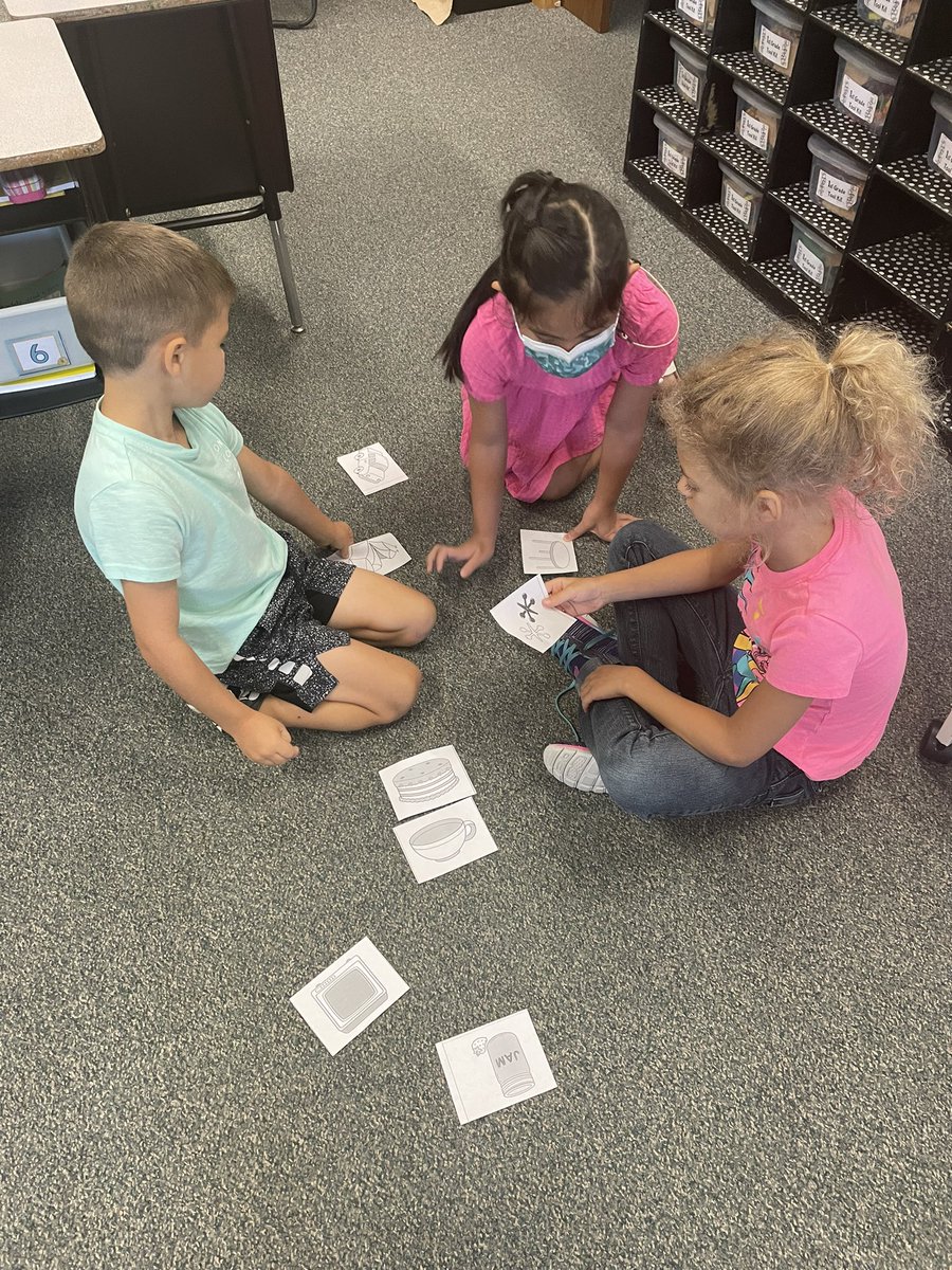 Working together to sort words with the same beginning sound.
