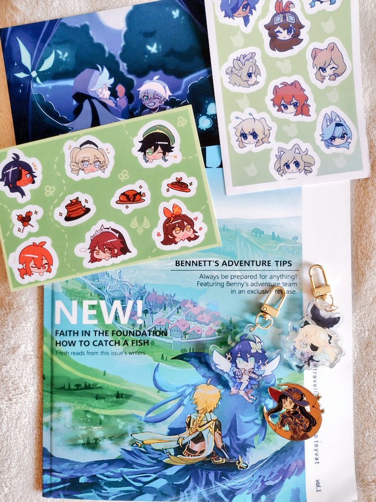 My travellers zine came today!! Aaah im so happy, look at them!! The chibi stickers!! The cuteass rannett surrounded by crystal flies!! The fischl and venti charms are so pretty i cant stop staring! And the mona pin!! So shiny!! 🥹💘💕💞

tysm <a href="/travellerszine/">Traveller's Guide to Teyvat!</a> creators!!