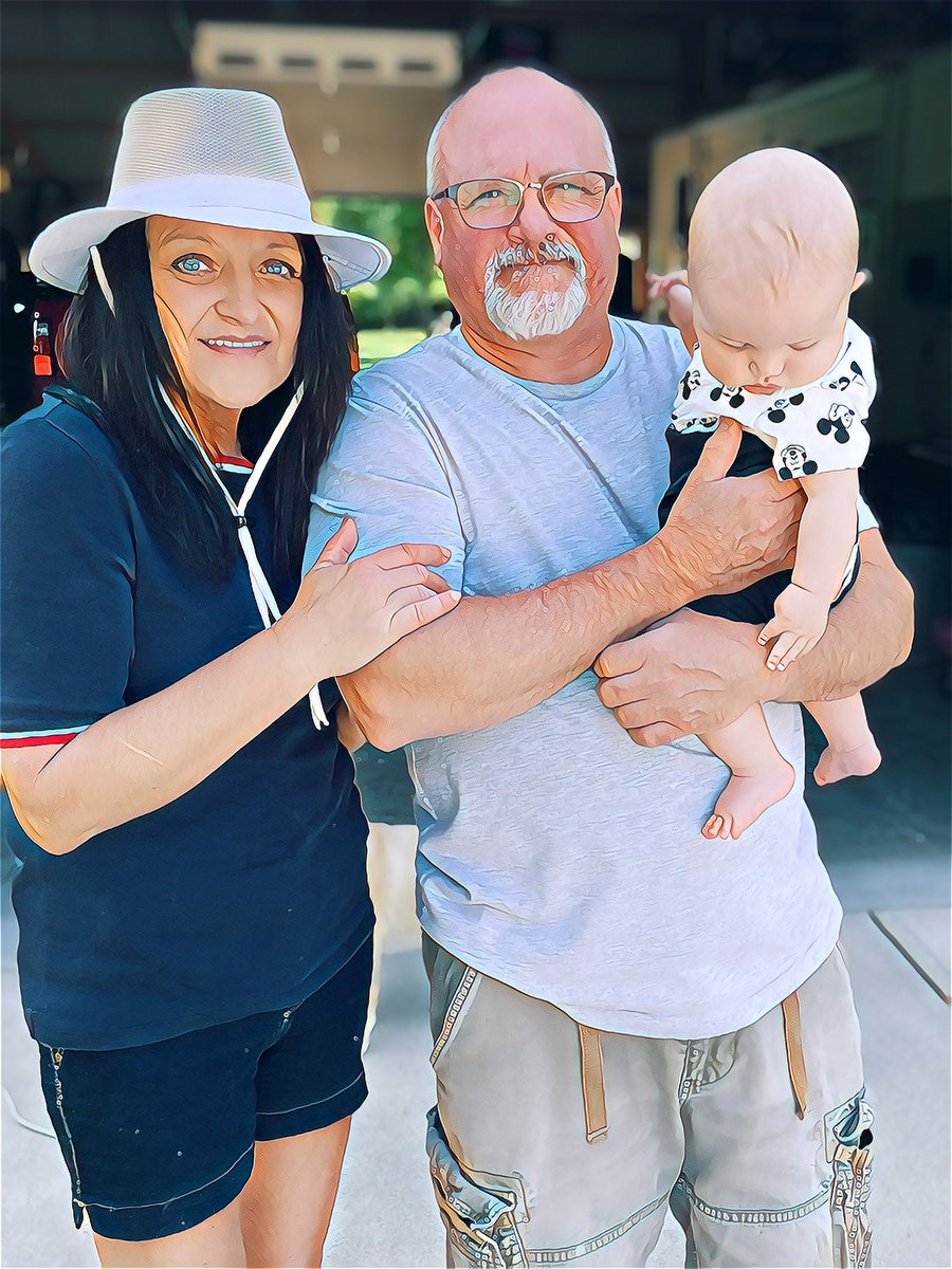 Me, my husband and little Axton! Lol..he’s much more interested in one of our dogs to look up!🤣🥰