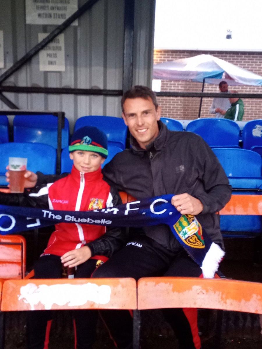 Jimmykayay's tweet photo. First father and son #AwayDay and it's a trip to @WSM_AFCOfficial with the @YateTownFC Bluebells. All kitted out in his @YateUnitedFC... Tuesday night floodlights... smashing down with rain... Absolutely bloody marvellous! C'mon Yate 👊 https://t.co/Hgwgz5Tvef