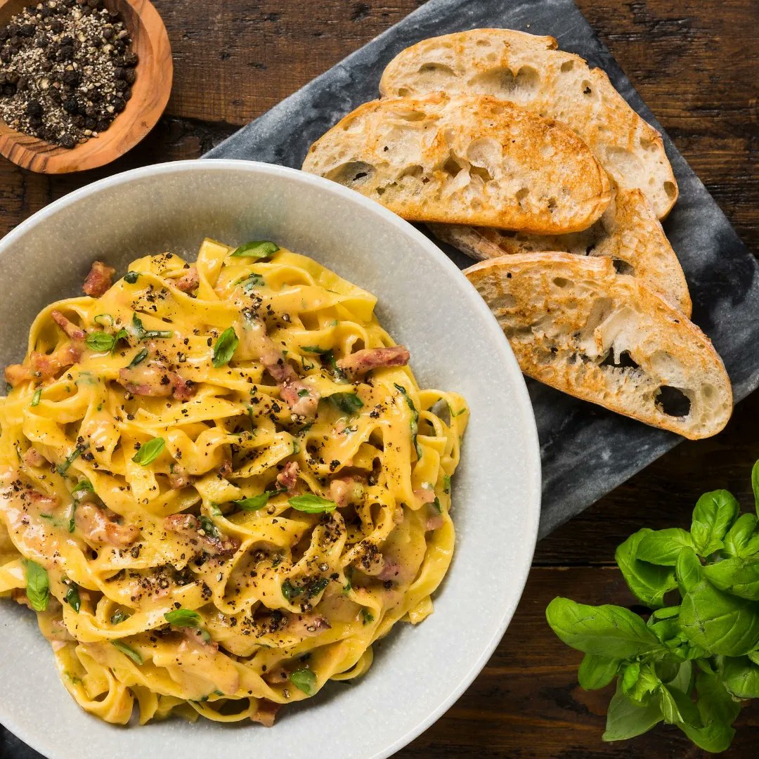 Carbonara:
is an Italian pasta dish made from Egg Yolks, With imo a load of grated Parmigiano Reggiano into the mix, some cured pork ( Guanciale) 
Touch of pasta water to loosen it and finish with Cracked black pepper
@chefgaryguiney insta