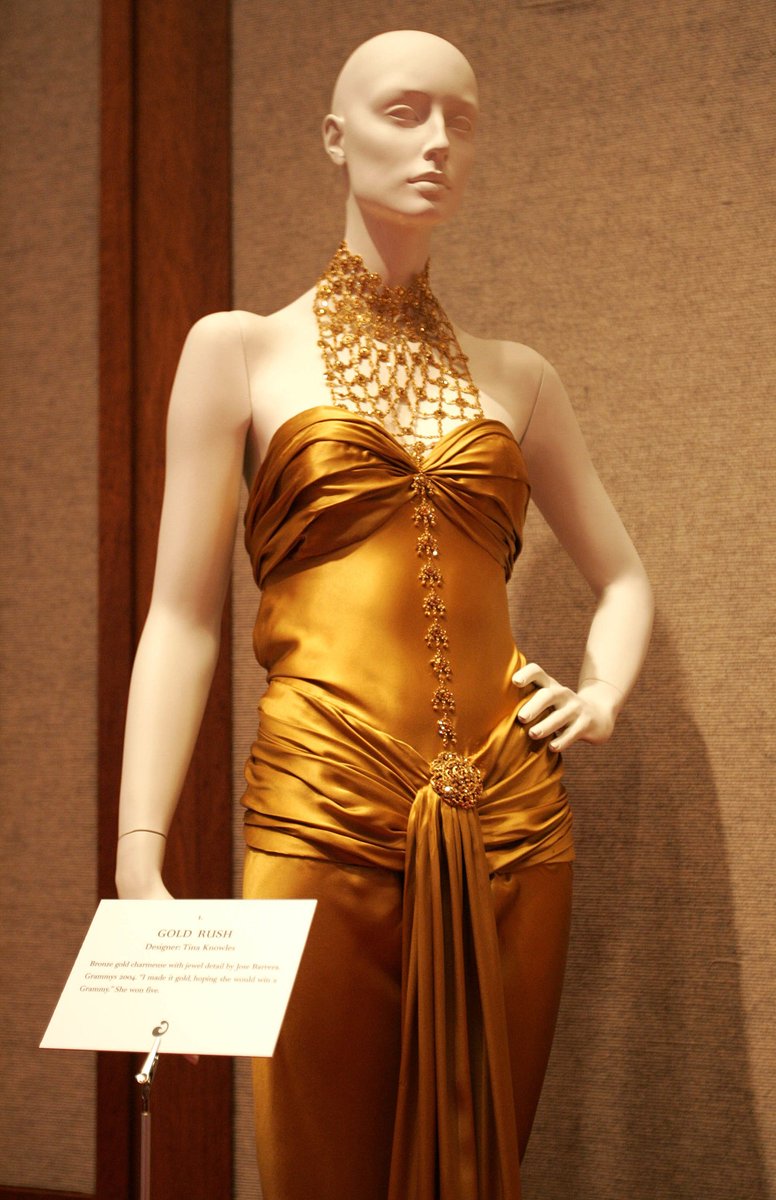 firstbeyonce4k's tweet photo. A dress designed by Tina Knowles and worn by singer Beyonce at the 2004 Grammy Awards on display at the "Beyonce: Beyond the Red Carpet auction presented by Beyonce and her mother Tina Knowles along with House of Dereon to benefit the VH1 Save The Music Foundation. https://t.co/Z5hoH4lg2n