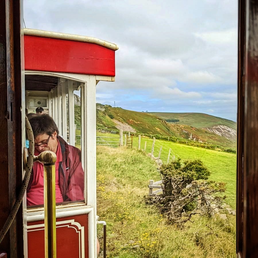 EcoWeeks's tweet photo. Sneaky shot of one of our excellent directors Ian as we trundle the tram to Laxy for a fun day of exploring! #ecoweeks #isleofman #laxy #candidshots https://t.co/3kg6aFf8yT