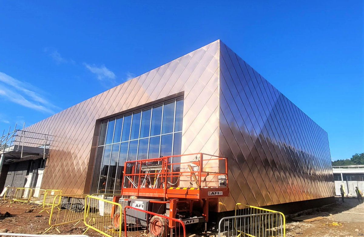 LongworthFacade's tweet photo. Works in progress at Seashell Trust. Our skilled operatives are currently installing Tecu Bronze shingles which is part of a larger roofing and facade package that we are carrying out for Willmott Dixon.

#tecu #bronze #metalsolutions #alm #kingspan #longworth #progress https://t.co/n1kN7LWA7q