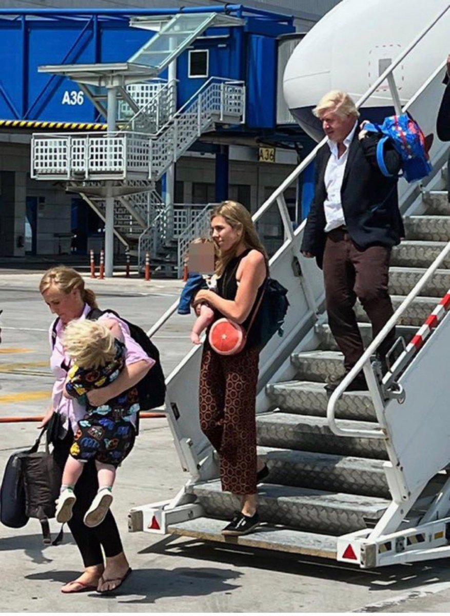 Never has a photograph so perfectly demonstrated the British class system.

Having to do the heavy lifting. (Necessity)

Being able to choose work that isn't "beneath" you. (Privilege)

Pretending you work. (Entitlement)