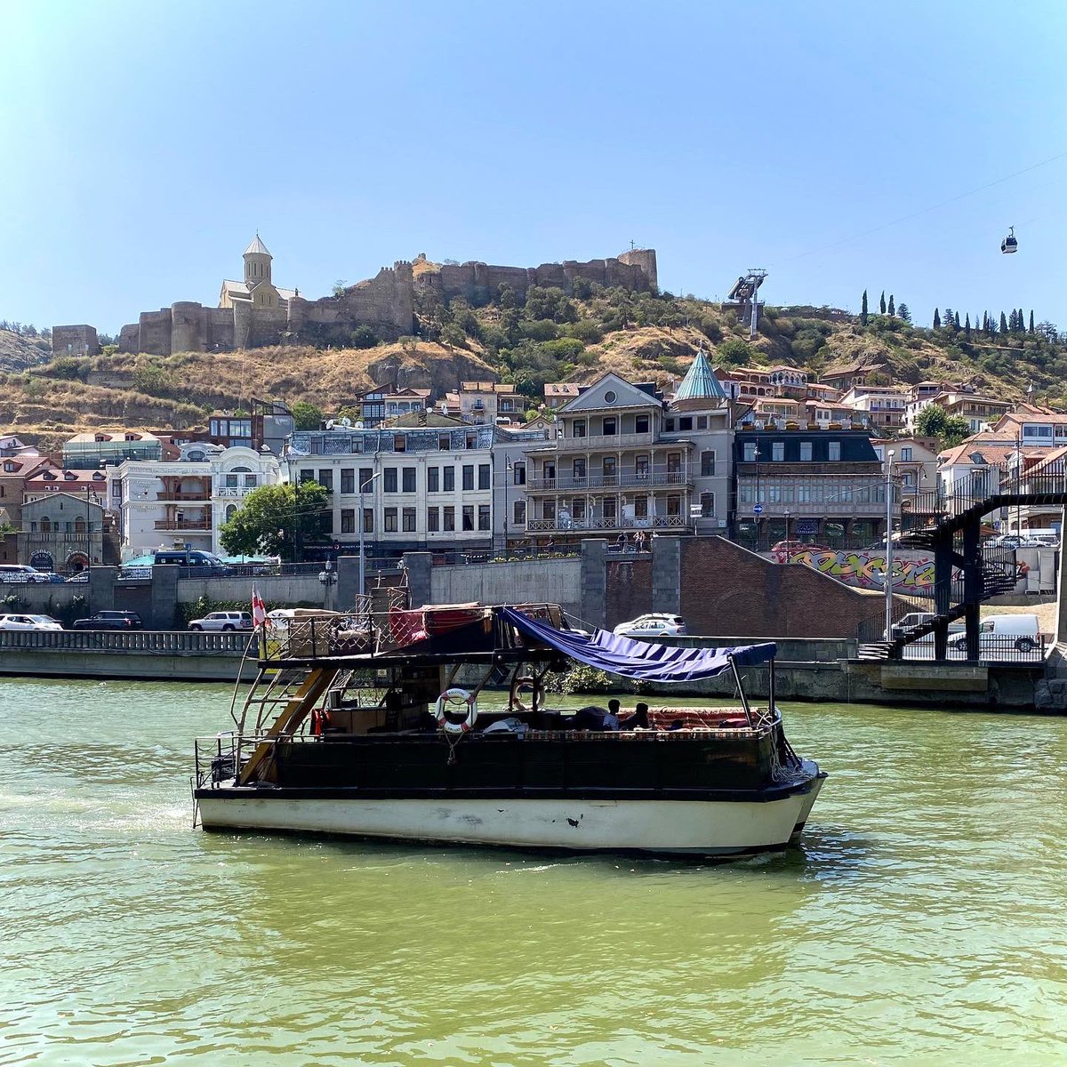 SouthCaucasus's tweet photo. Boat Trip on Mtkvari River in Tbilisi. @Reise_KnowHow #ReiseKnowHowGeorgien - more: https://t.co/giHJGxvbzO https://t.co/ZhSVSNFwqG