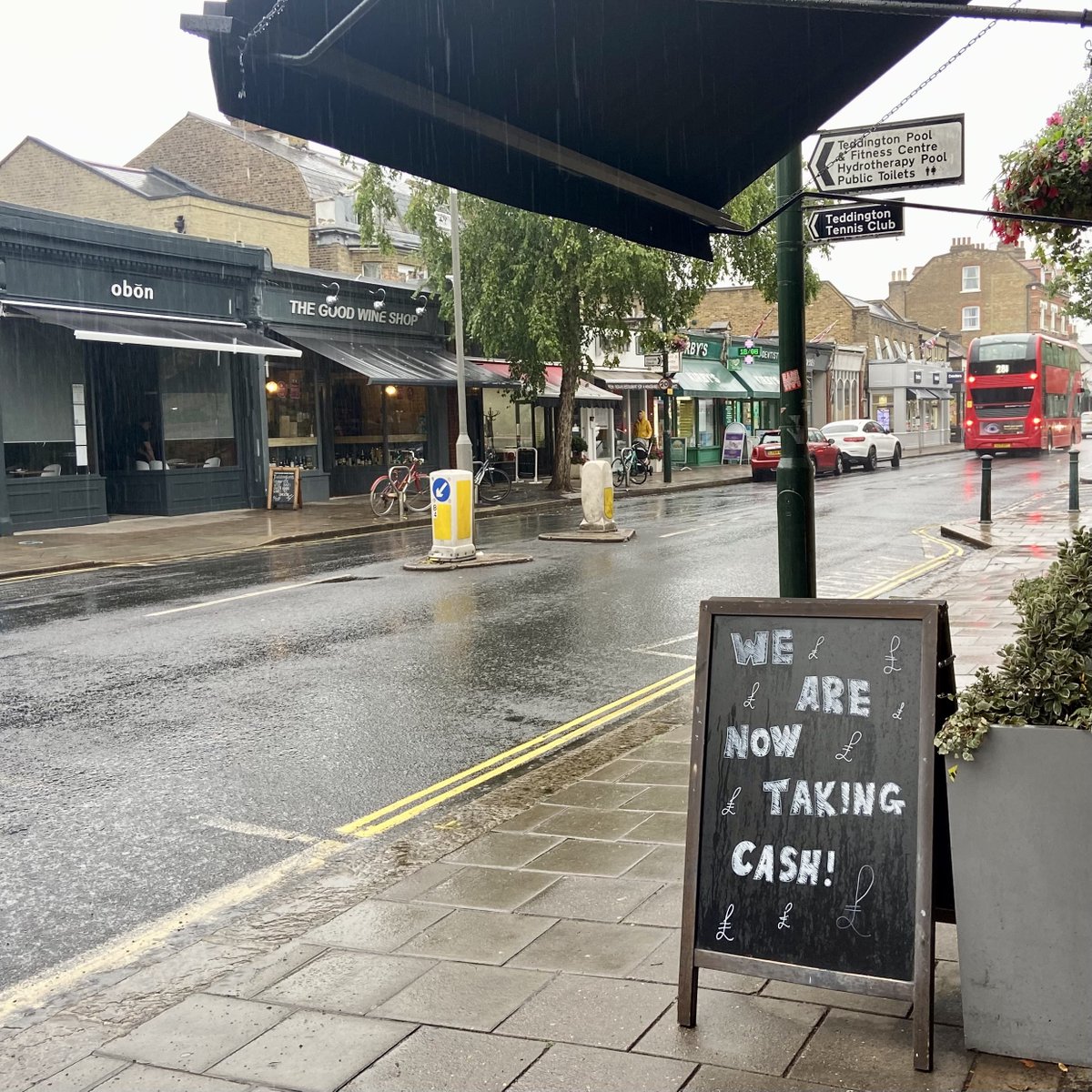 TeddingtonArms's tweet photo. British summer time trying its best to wash off our board, but we are still accepting cash as of this week!
#cashisback #cashandcardpayments #britishsummertime #rainrain #stormywednesday #teddington #highstreet #blackboard #washingaway #awning #drypub #dontkickthebollards https://t.co/r4v9iFGMgJ