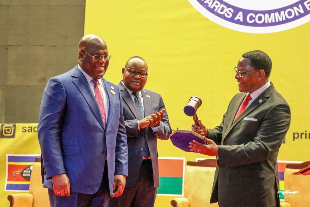MalawiTweet's tweet photo. The President of the Republic of Malawi, Dr. Lazarus McCarthy Chakwera handing over the SADC chairmanship mantle to DRC president Felix-Antoine Tshisekedi Tshilombo during the the 42nd Ordinary Summit of SADC Heads of State and Government opening ceremony. #SADCCHAIR https://t.co/4qj4afSQ4o