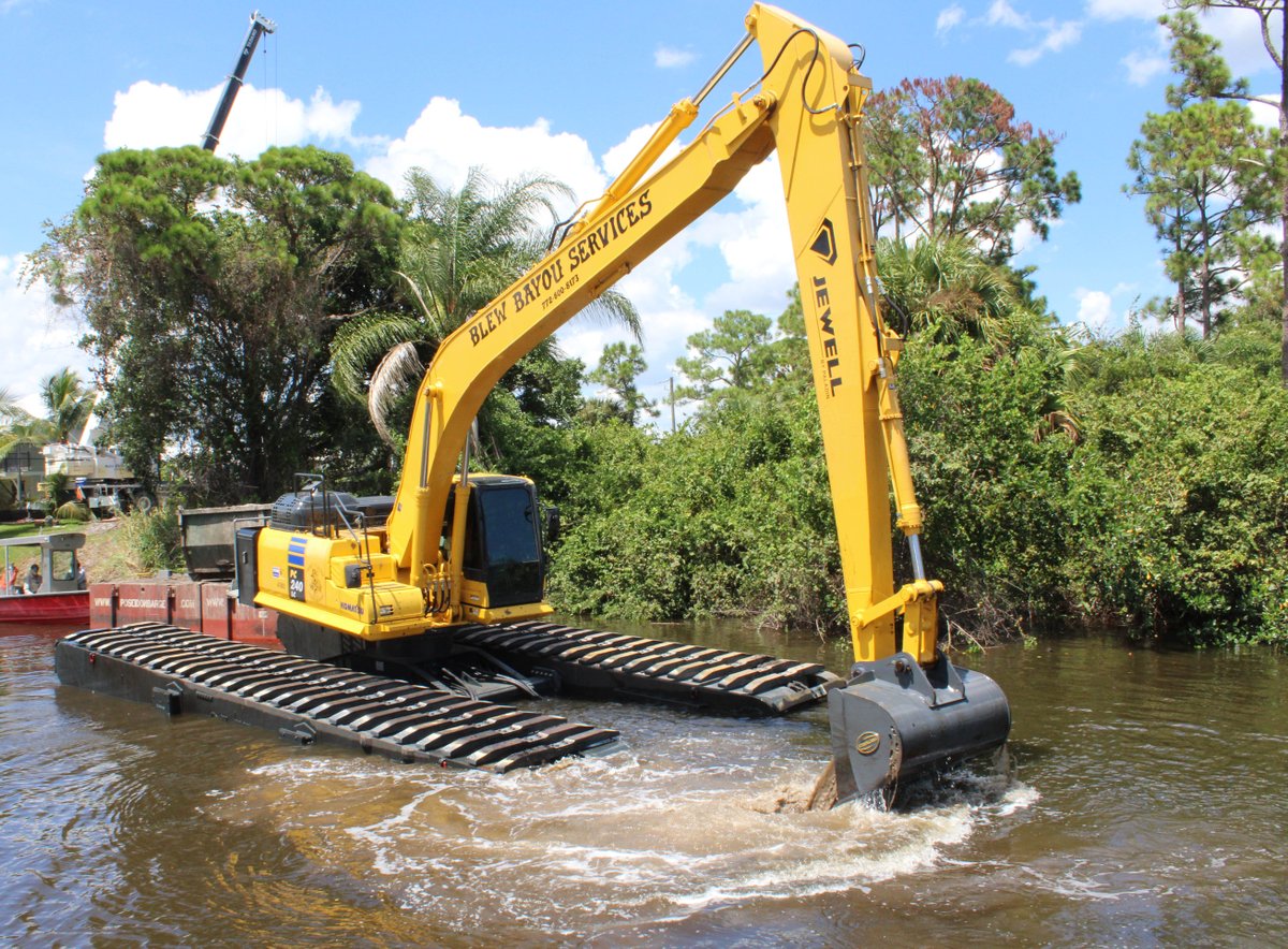 LinderMachinery's tweet photo. Check out this OLKO/Komatsu in action. Crews from Blue Bayou Services are using their new pontoon undercarriage and PC240 to dredge a canal in Port Saint Lucie.
#komatsu
#OLKO
#dredgingwork https://t.co/ZP7VDopN4q