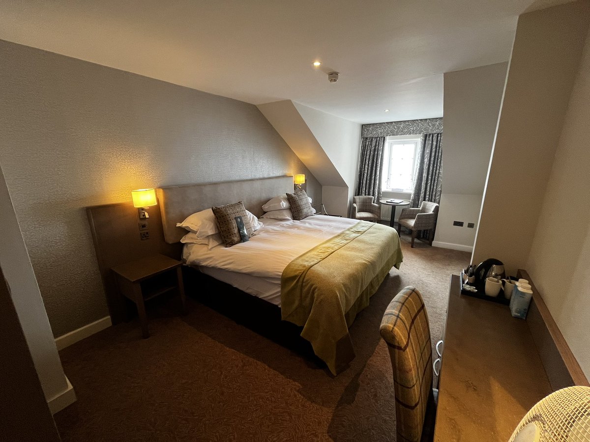 Ballygally Castle, Northern Ireland.
Plug by bed, ok shower, free instant wifi, no biscuits, haunted.