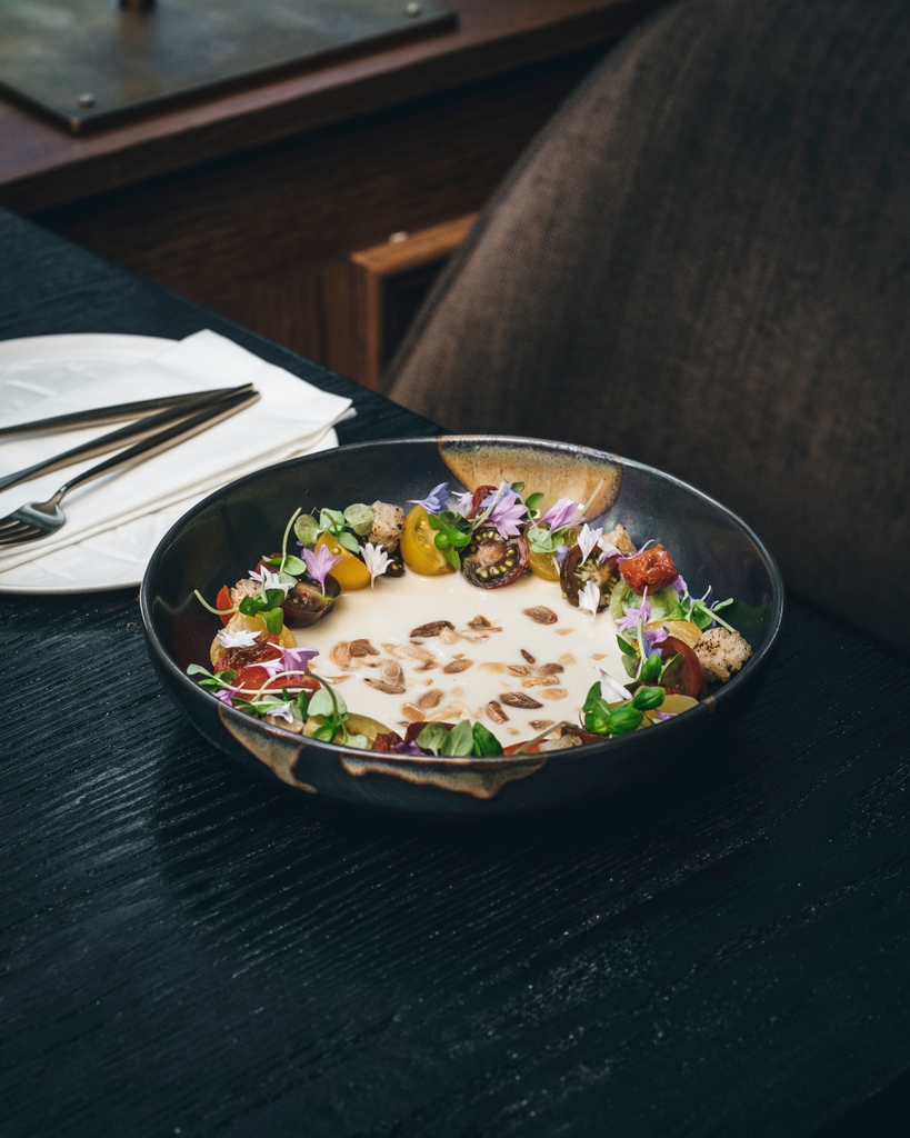 Heritage tomato salad. Made up with colourful tomatoes sourced from the Mediterranean, Ajoblanco - a Spanish chilled white gazpacho and a fragrant drizzle of Spanish virgin olive oil. 

The perfect way to enjoy the summer harvest.