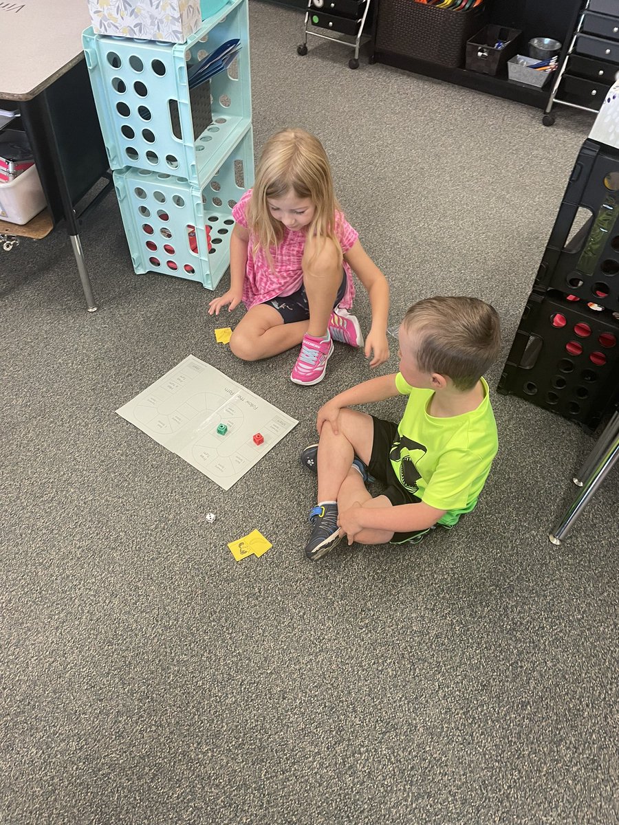 Practicing naming the beginning sounds of pictures with a partner. Awesome partner procedures happening!