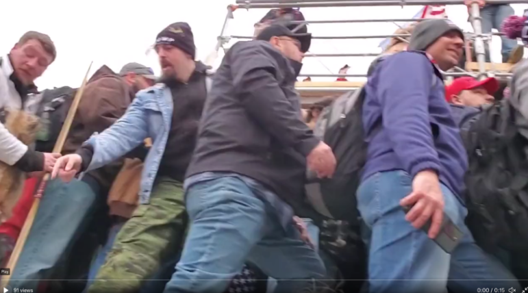 DianthaSol's tweet photo. #BloodyHeadWound/#KyleFitzsimons changed into his "fighting costume" before storming the Capitol. Not only did he wear his real butcher apron and coat with his name on it, he wore a large full-body fox pelt and carried a wooden unstrung bow later thrown at police as a spear. https://t.co/zUuu7Qs4NB