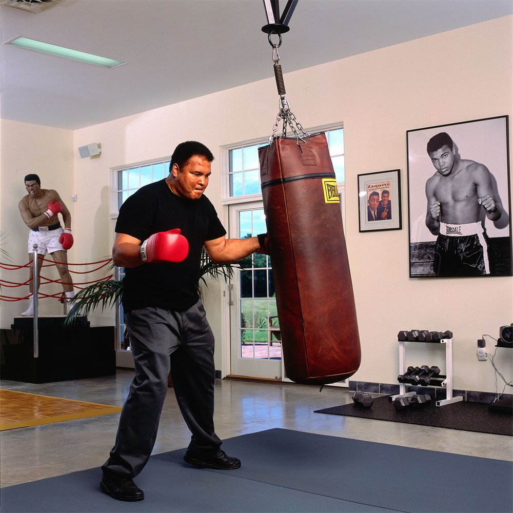 Muhammad Ali punching a heavy bag during a photo shoot in his gym at his farm on Kephart Road. Oronoko Township. August, 2001. 

📸: <a href="/LeiferNeil/">Neil Leifer</a> 

#MuhammadAli #August #NeilLeifer #Gym #Heavybag