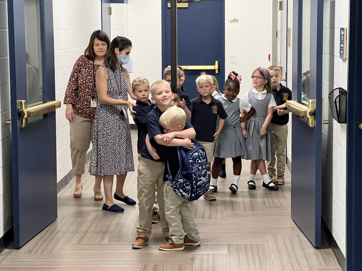 StMSCary's tweet photo. It's your first day of school,  and you see your big brother in the hall! #familyhugs #StMS2022 https://t.co/RyT0sGwqom