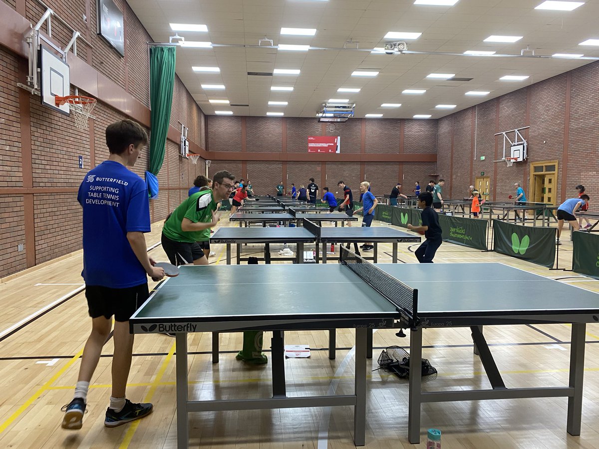 walesTT's tweet photo. Another great day of Table tennis over 🏓. A full hall and lots of hard work.  Looking at 3rd ball this morning and Tactics and variation this afternoon. Well done to Ben our player of the day.  Bring on the Crazy Golf ⛳️ tonight https://t.co/VN5FdPf6J3