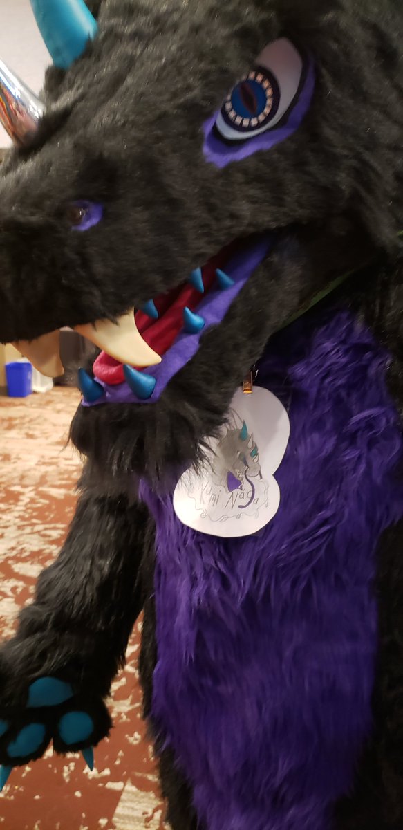 AlloyFirescale's tweet photo. I found this amazing dragon at #WPFC2022.
I love the variety of different horns\spikes\teeth that they have!   RAWR!  

Their badge says "Kumi Naga".  If you know their Twitter name, please tag them here.

🐉: Kumi Naga

#wpfcon #wpfcon2022 #wpfcon22 #WildPrairieFurCon #dragons https://t.co/YW2cyNENUP