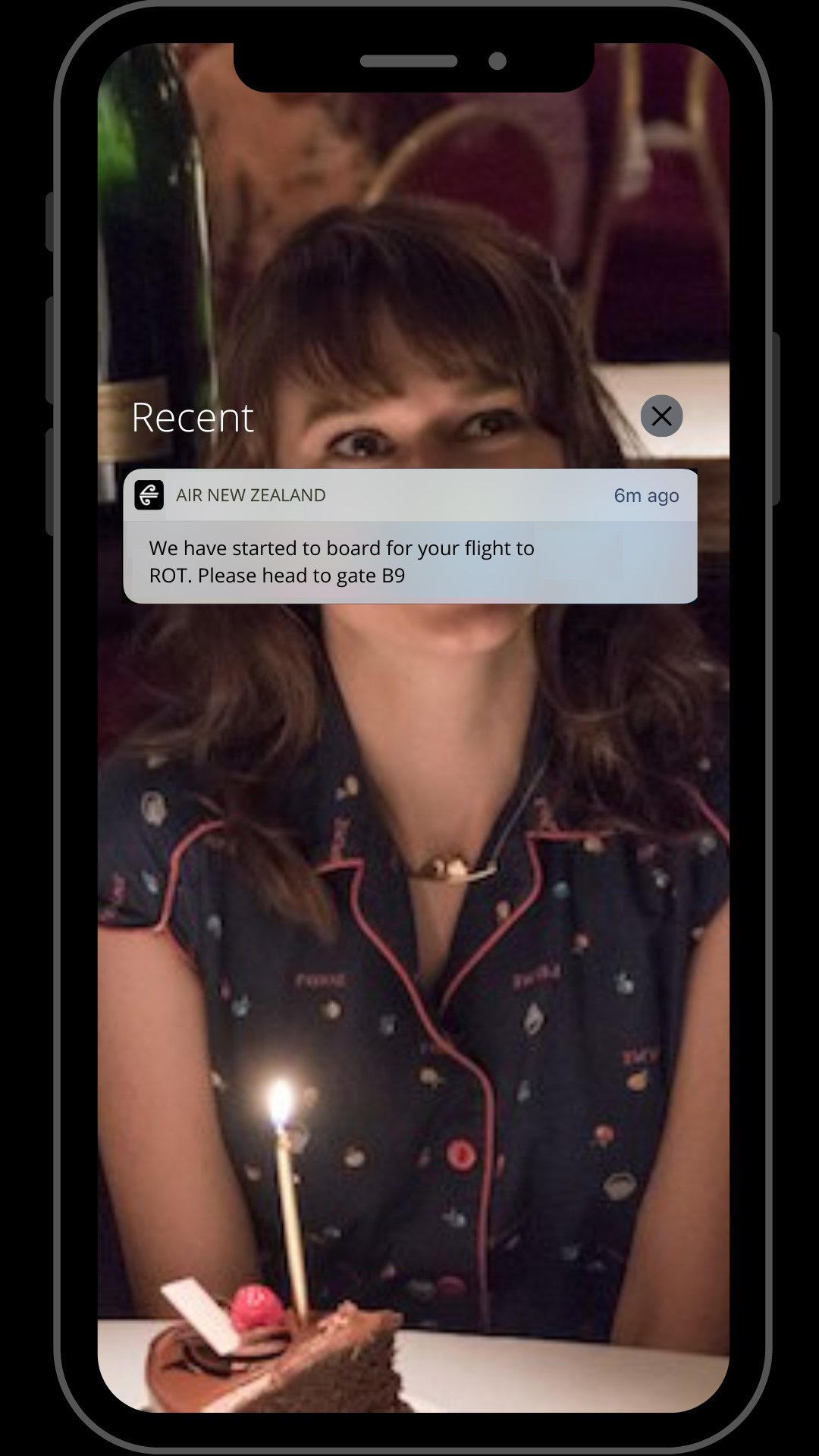Shot of Stede's phone with the flight boarding information on it