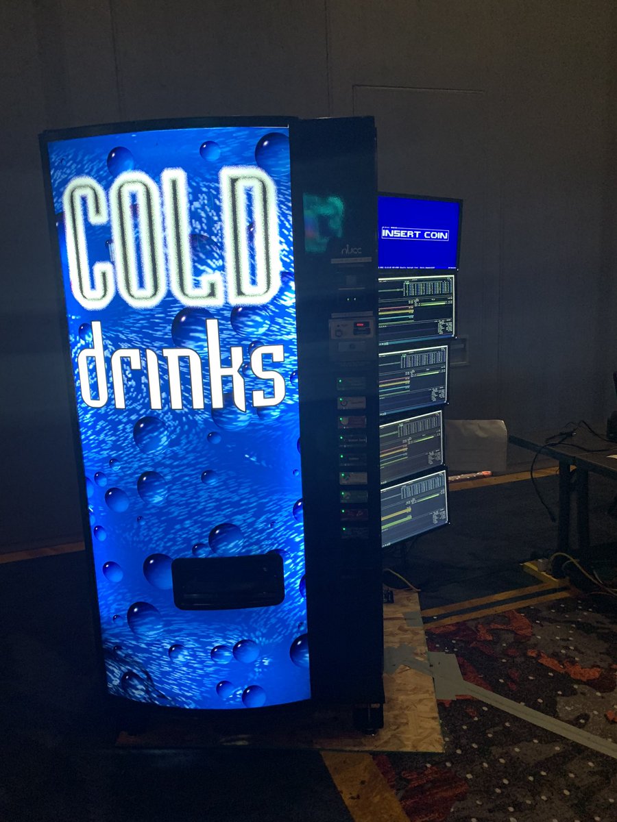 TipsyBacchus's tweet photo. I’m gonna be honest this is the coolest thing that was at Defcon this year. A VM vending machine. #DEFCON30 https://t.co/xN2oXQIa40