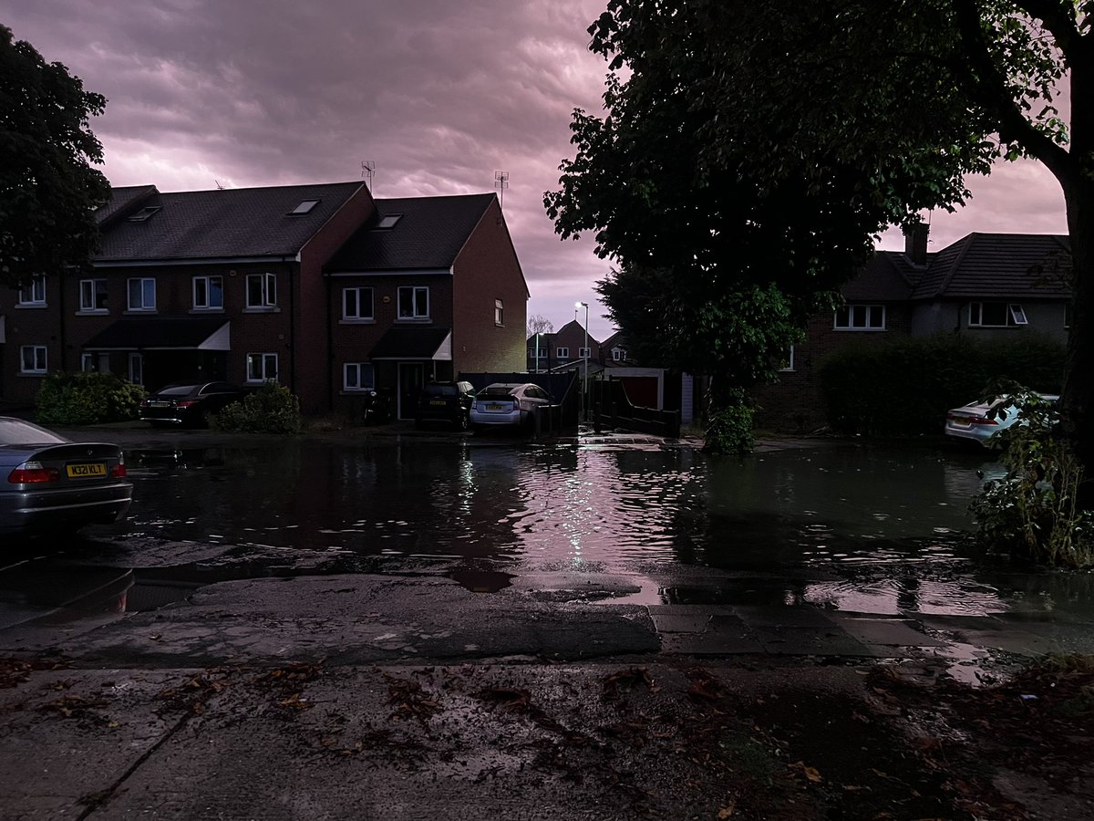 AdamTruths's tweet photo. @LBofHavering - appreciate the lads coming round to flush the drains after the flood had dissipated at 10:30am, but are there any plans to sort something out so our road doesn’t become a river every time there is any heavy rain? This was after just an hour of rain, 4:30am! https://t.co/ACkVIGTvlP