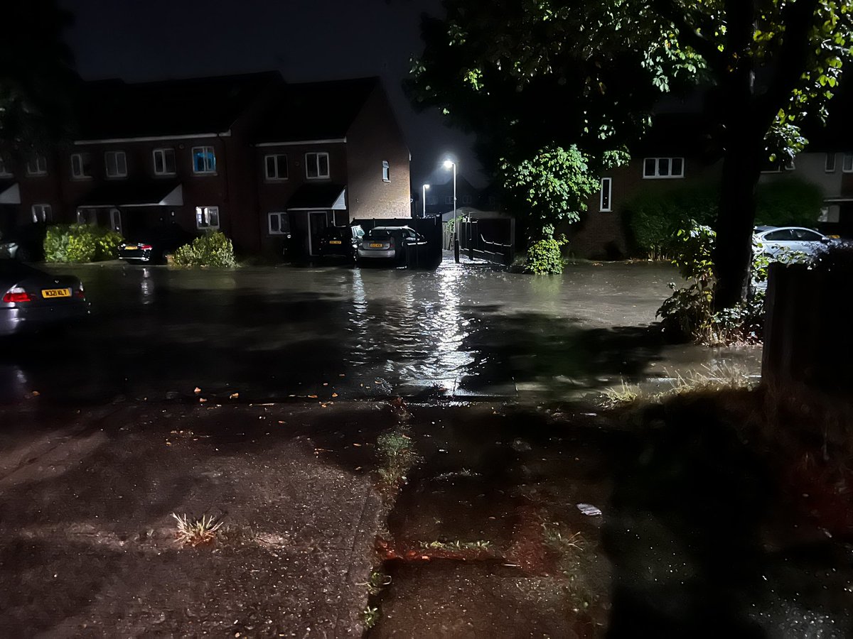 AdamTruths's tweet photo. @LBofHavering - appreciate the lads coming round to flush the drains after the flood had dissipated at 10:30am, but are there any plans to sort something out so our road doesn’t become a river every time there is any heavy rain? This was after just an hour of rain, 4:30am! https://t.co/ACkVIGTvlP