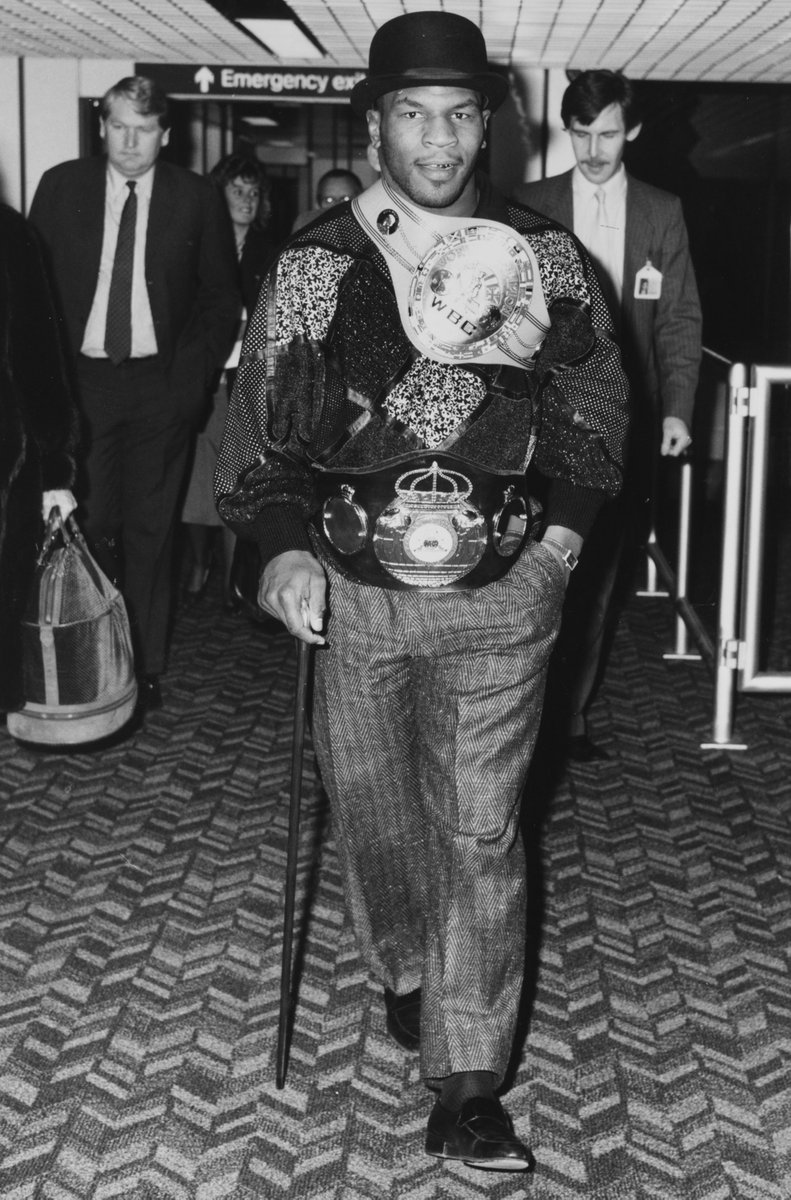 BoxingHistory's tweet image. Mike Tyson, the consensus "Baddest Man on the Planet," strolls into London in 1987.