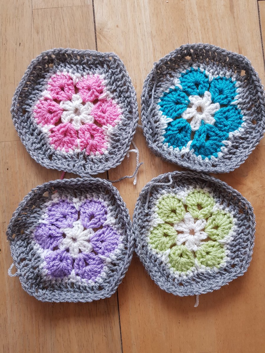 kendie's tweet photo. I now have four crochetted African flowers, all a bit different and all a bit unique 😂 #crochet #crocheting  #africanflower https://t.co/qy911lrRIr