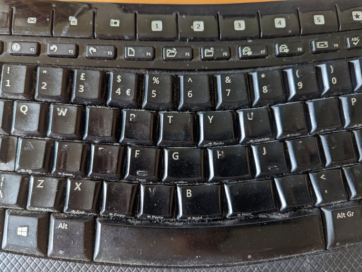 Many years of use.
It's just as well I can touch type.