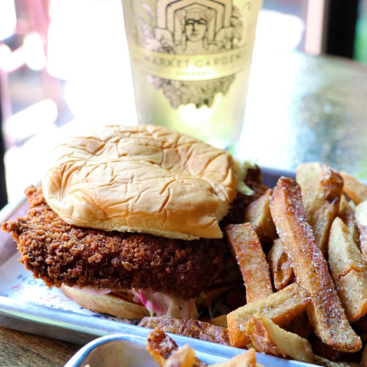 MarketGardenCLE's tweet photo. Leveling up your dinner game this week with our Pork Schnitzel Sandwich - breaded pork loin, basil lemon aioli, and coleslaw, on a fluffy potato roll.
Now at #marketgardenbrewpub.
#marketgardenbrewery #ohiocity #clefood #clevelandfoodie #schnitzel #clevelandeats #happyincle https://t.co/b9ALaIeFul