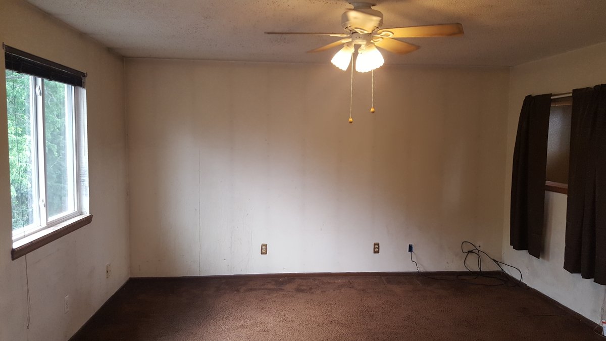 This room needs more than just a fresh coat of paint. What problems can you spot in this room? What would you write in your report?