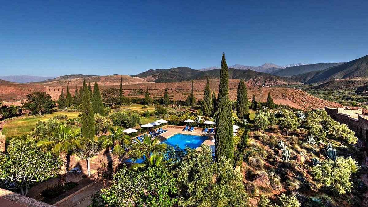The established gardens and inviting pool at Kasbah Angour, in the Atlas Mountains, a gorgeous boutique hotel for everyone, from couples and families, to groups wanting a idyllic spot for a yoga retreat... mintmorocco.com/kasbah-angour/🌴💜☀️